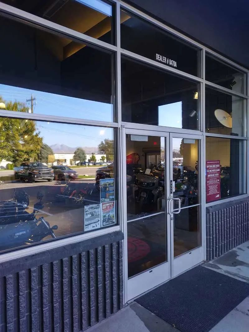 A store front with a lot of windows and doors