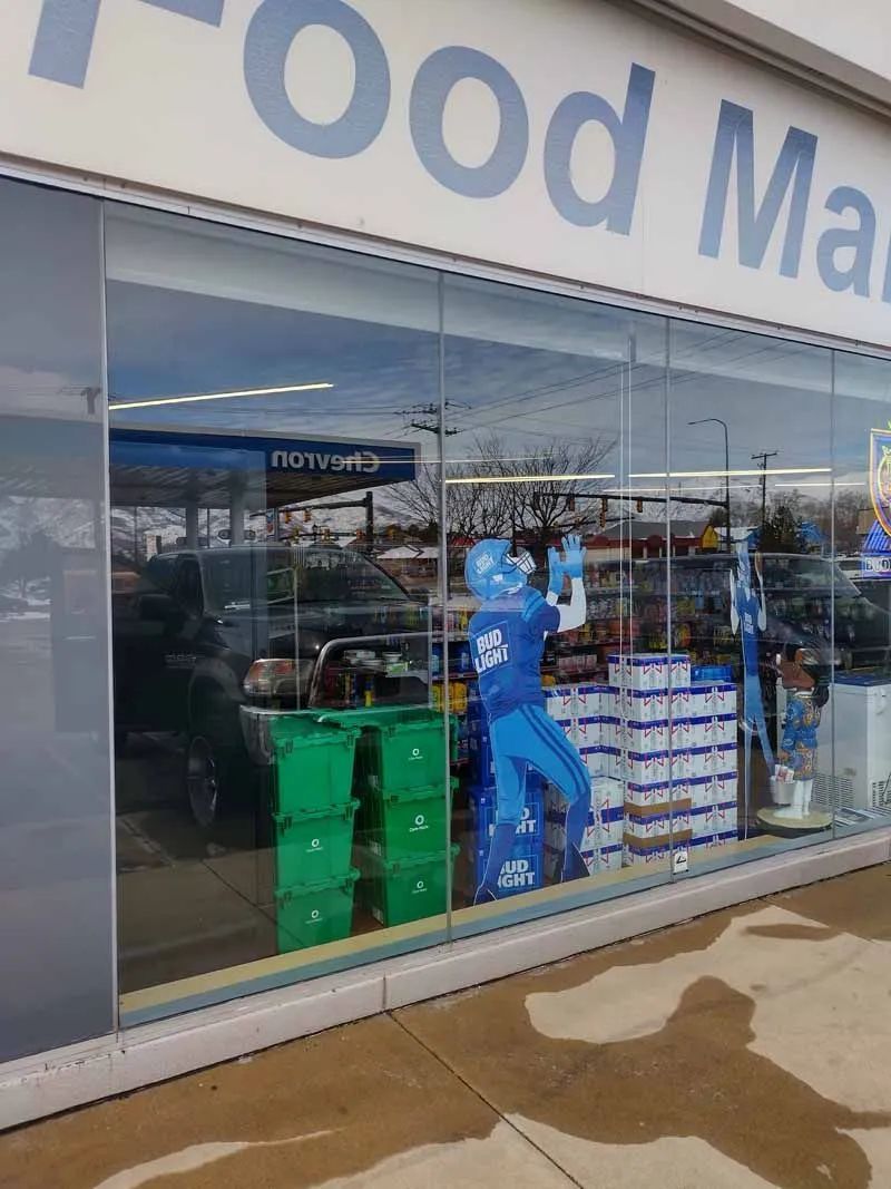 A store front with a sign that says ' food mart ' on it