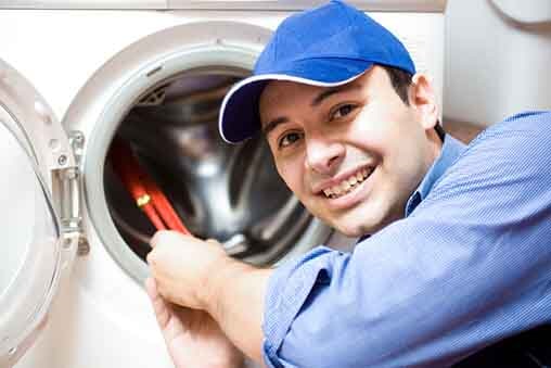 Techinican Repairing a Washing Machine – Prompt HVAC & Appliance Service in Plainfield, IL