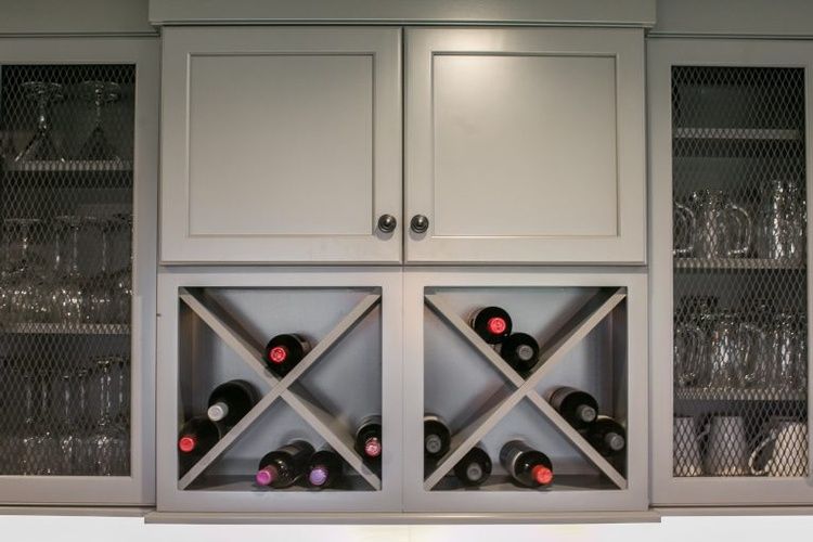 A wine rack with bottles of wine in it