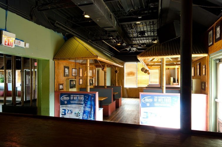 An empty restaurant with a sign that says exit on it