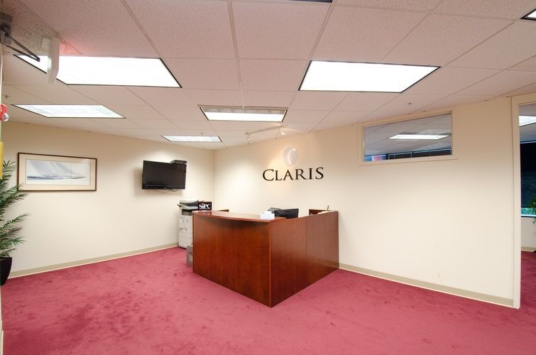 A large room with a claris sign on the wall