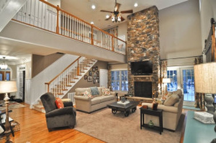 A living room filled with furniture and a fireplace.