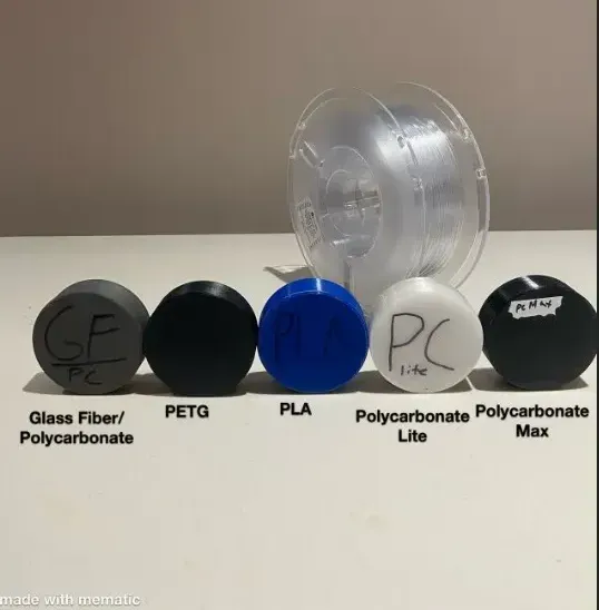 Six pucks of various materials used in the 3d printing process.