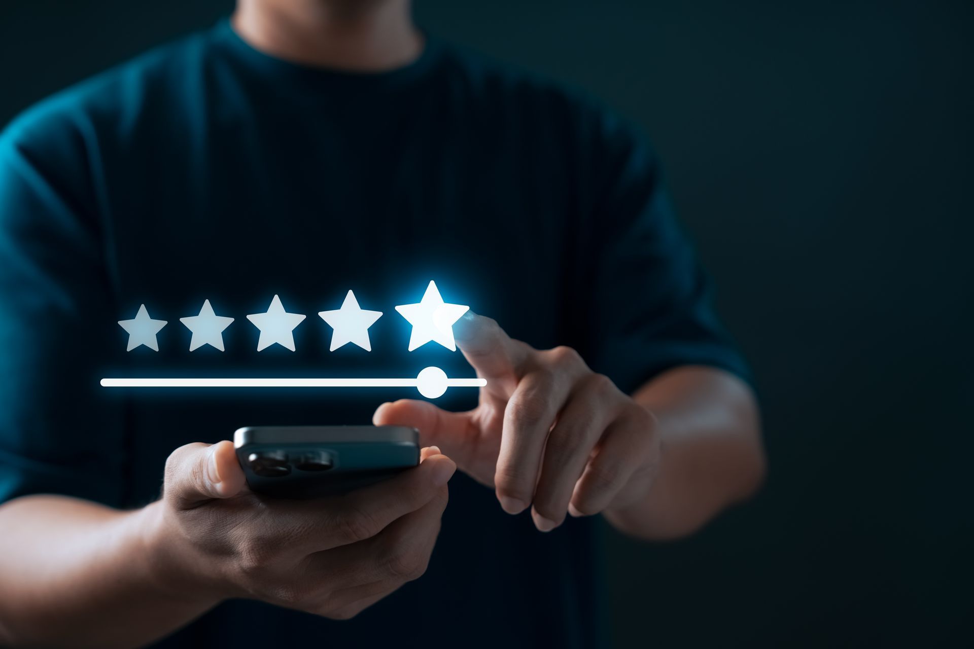 Person giving a five-star rating on a smartphone screen, against a dark background.