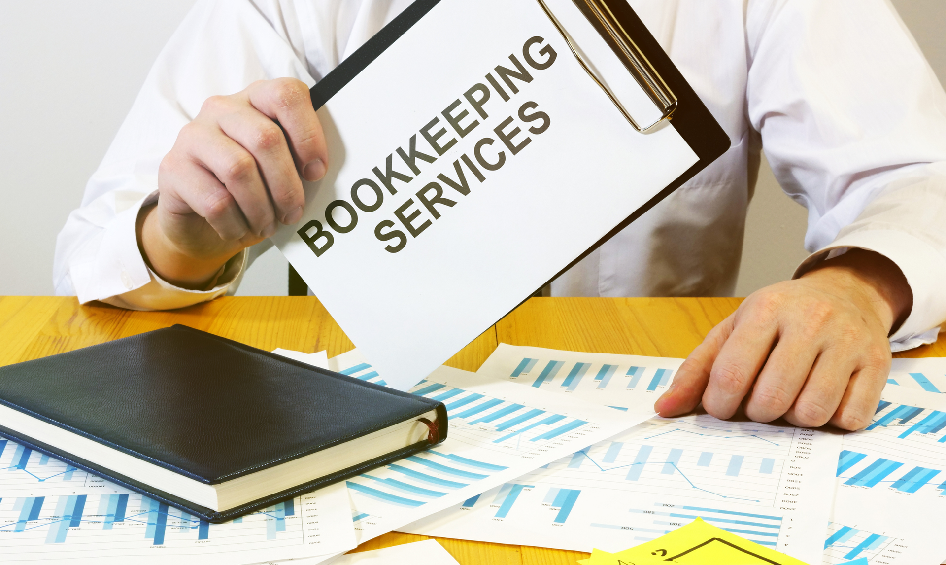 Person holding clipboard with 