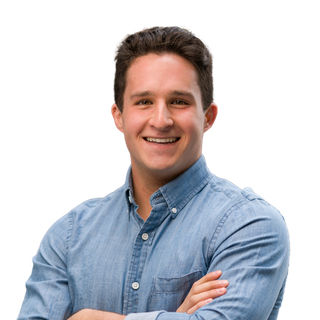 Man with dark hair smiling, wearing a blue button-down shirt, arms crossed. Man with dark hair smiling, wearing a blue button-down shirt, arms crossed.