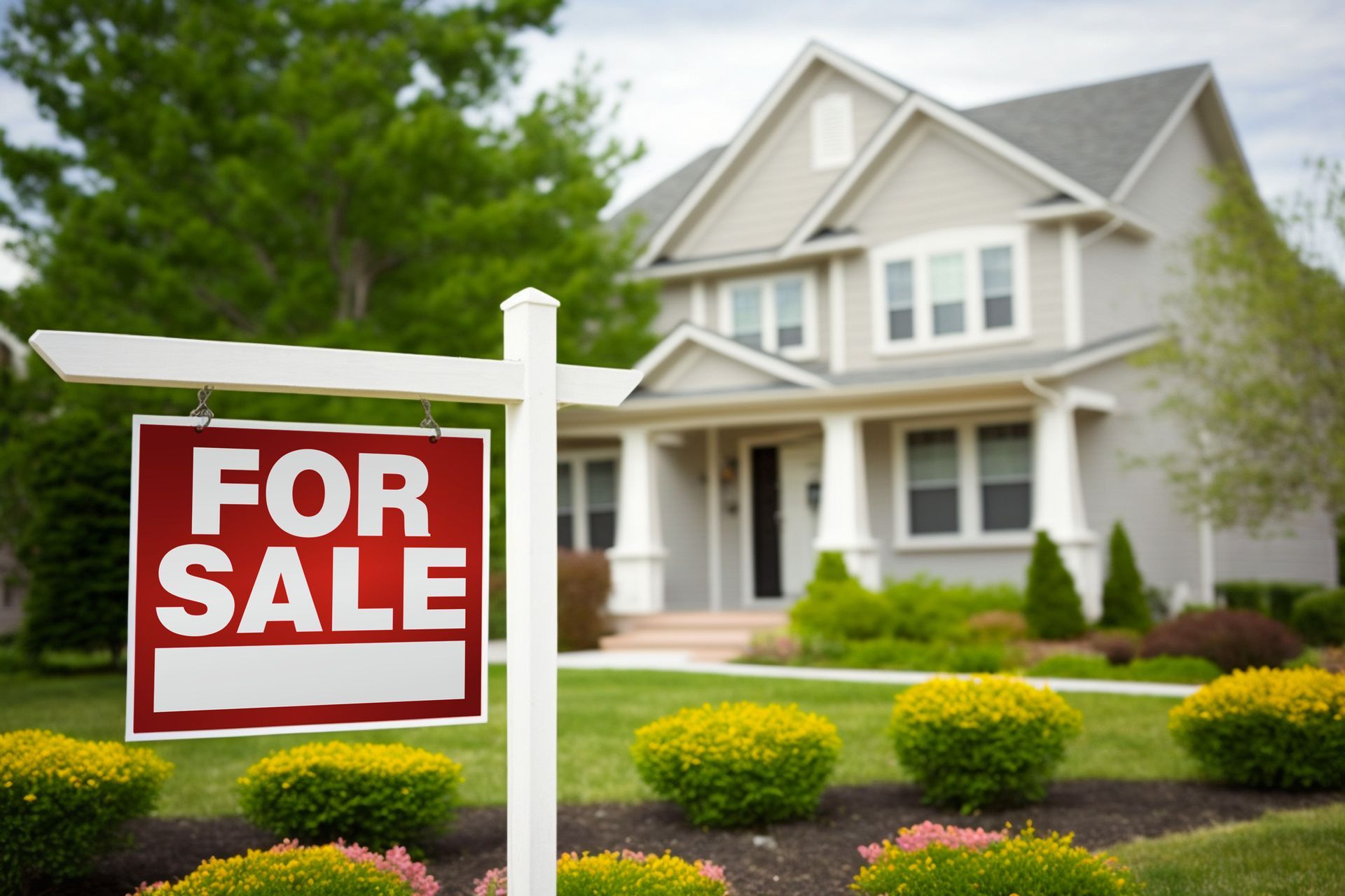 Houses for sale sign in front of a suburban home with a landscaped yard. Houses for sale sign in front of a suburban home with a landscaped yard.