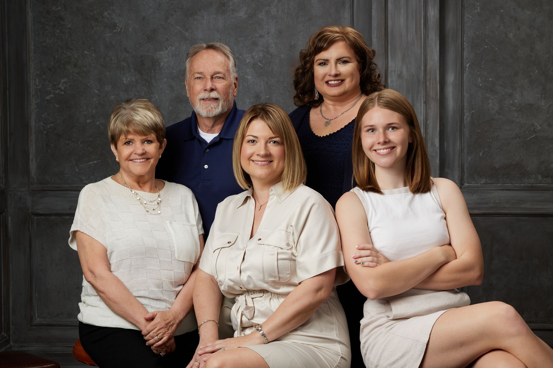 A group of people are posing for a picture together. A group of people are posing for a picture together.