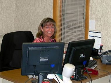 Assistant at desk — Kalamazoo, MI — Roto-Rooter of Southwest Michigan