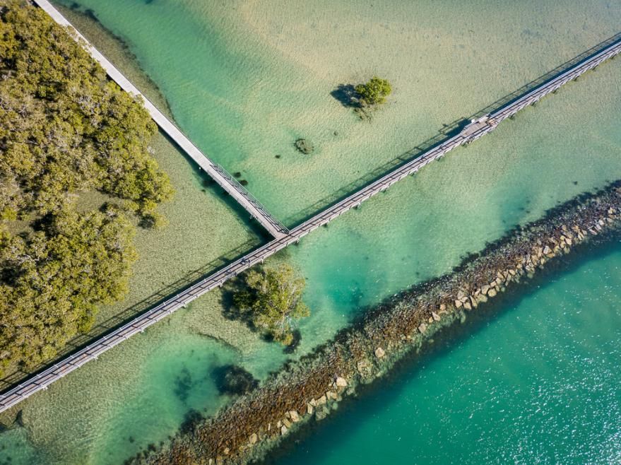 An Aerial View of A Bridge Over a Body of Water — Coffs Coast Plumbing in Urunga, NSW