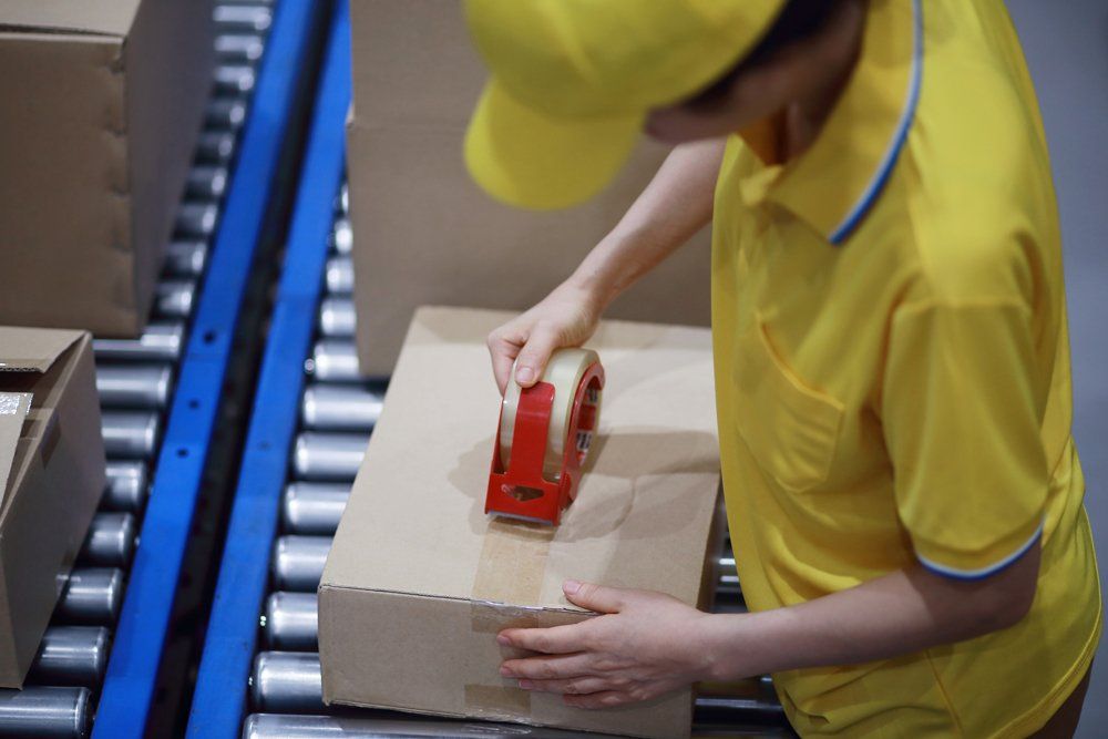 Worker Packaging The Parcel - Farmington Hills, MI - Zoom2Day Deliveries