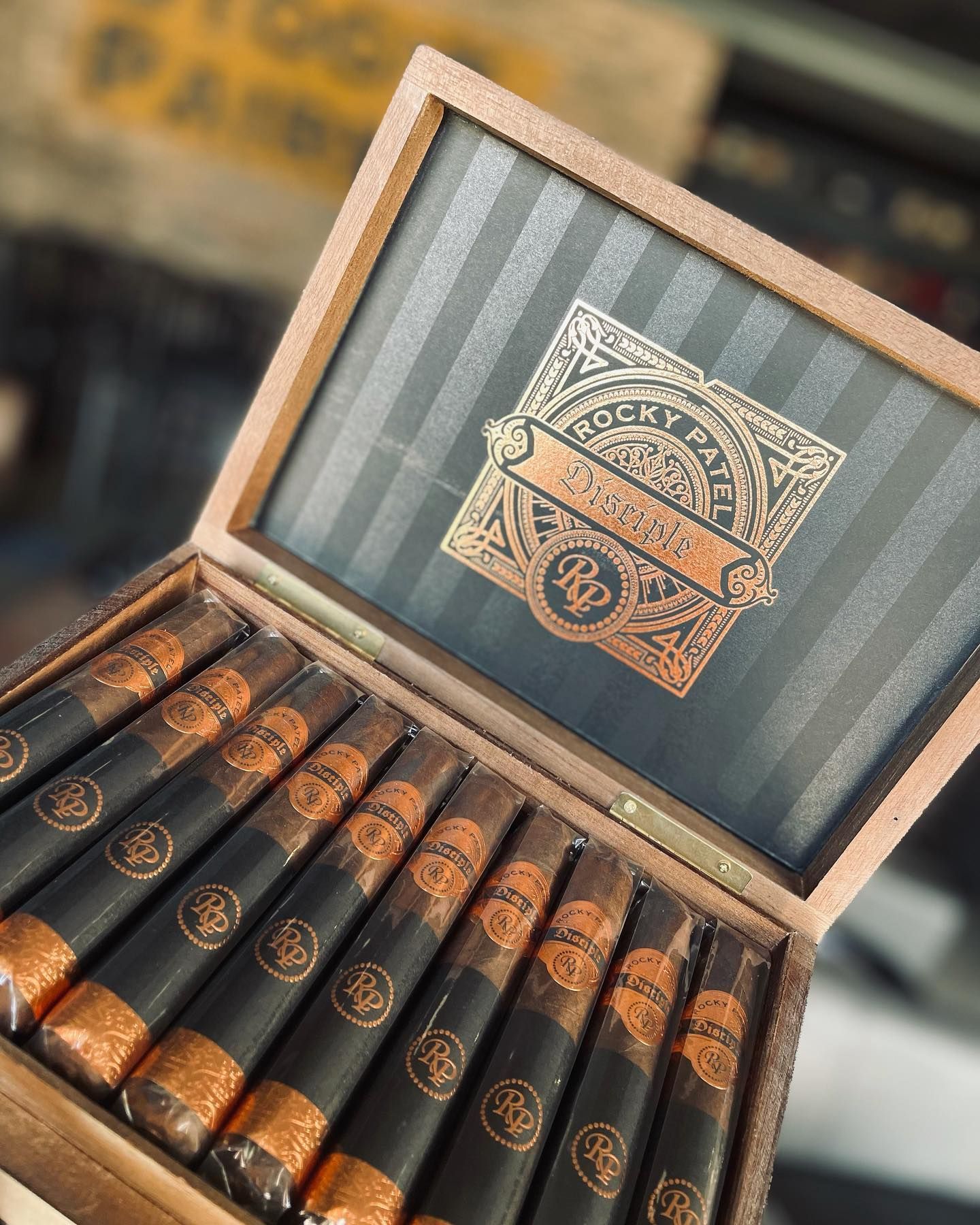 A box of cigars is sitting on a table.