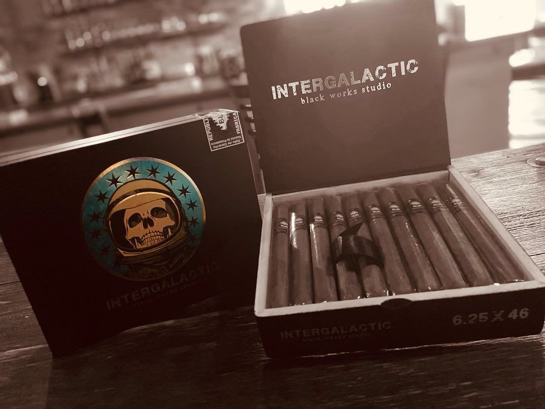 A box of intergalactic cigars sits on a table