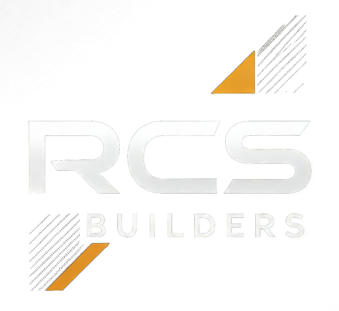 Logo for RCS Builders: Silver letters with orange accent triangles and line details.