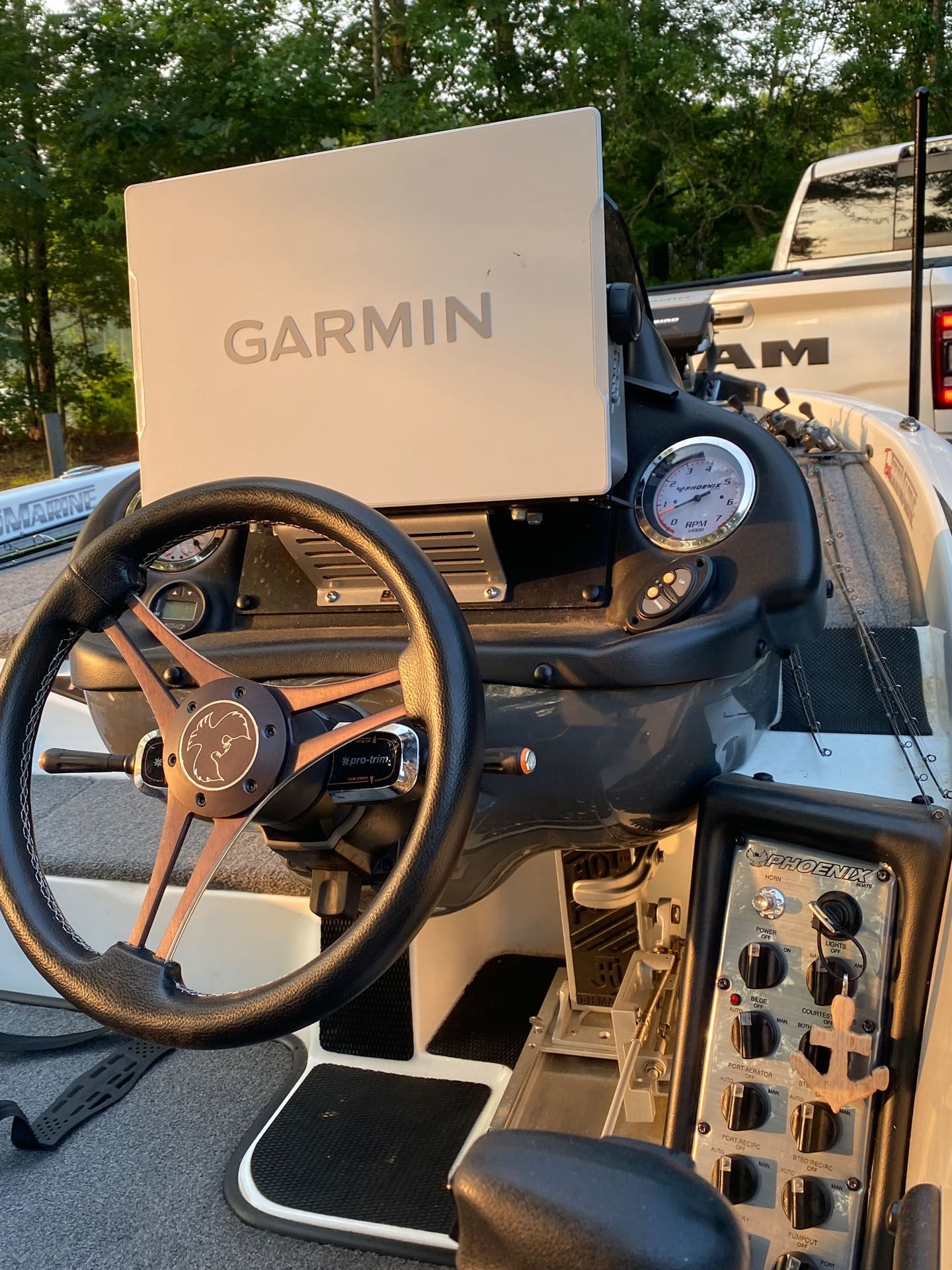 A garmin device is sitting on top of a boat.