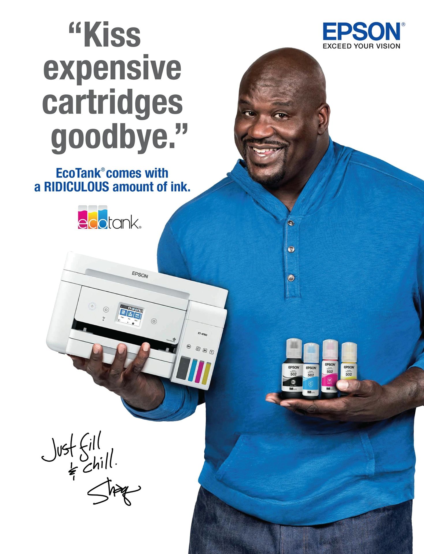 A man in a blue shirt is holding a printer and bottles of ink.