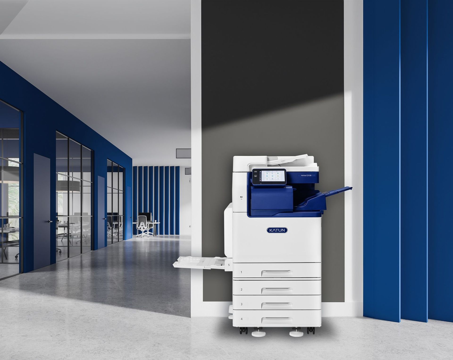 A printer with a computer on a stand next to it