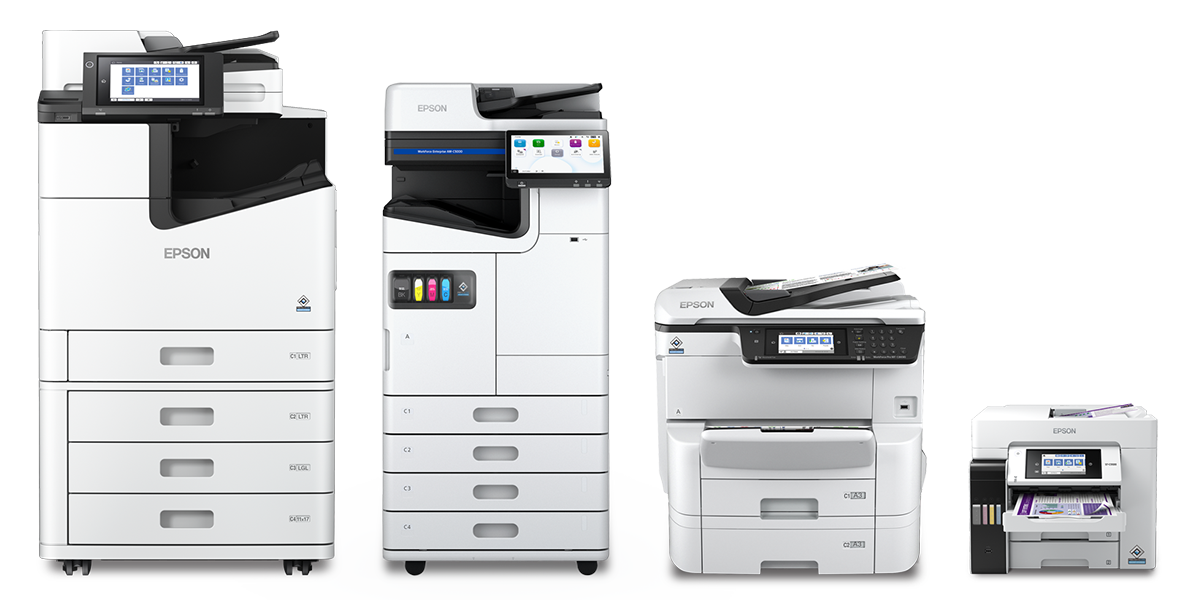 A group of printers sitting next to each other on a white background.