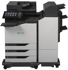 A lexmark copier is sitting on top of a cart on a white background.