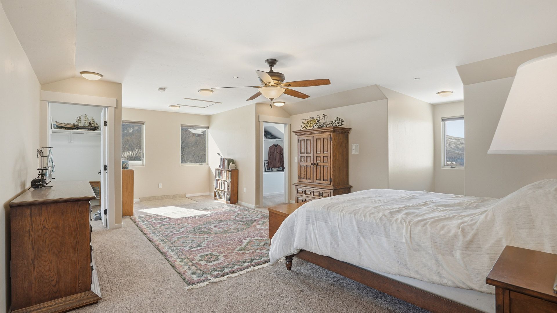 Spacious primary bedroom retreat with vaulted ceilings and dedicated office space in Timber Lakes.