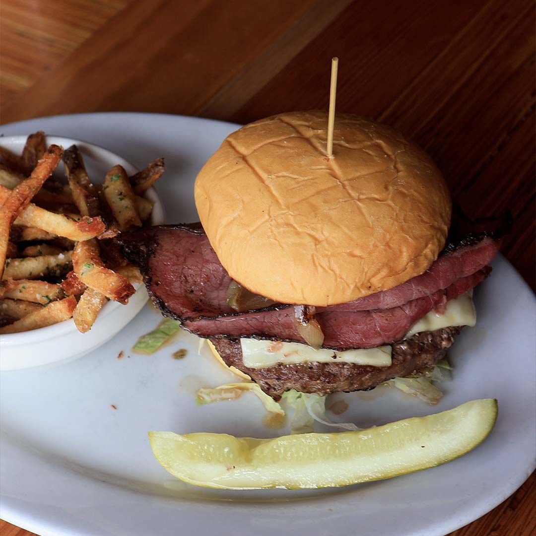 The signature Back 40 Burger featuring locally sourced grass-fed beef and melted Heber Valley cheese on a toasted bun.