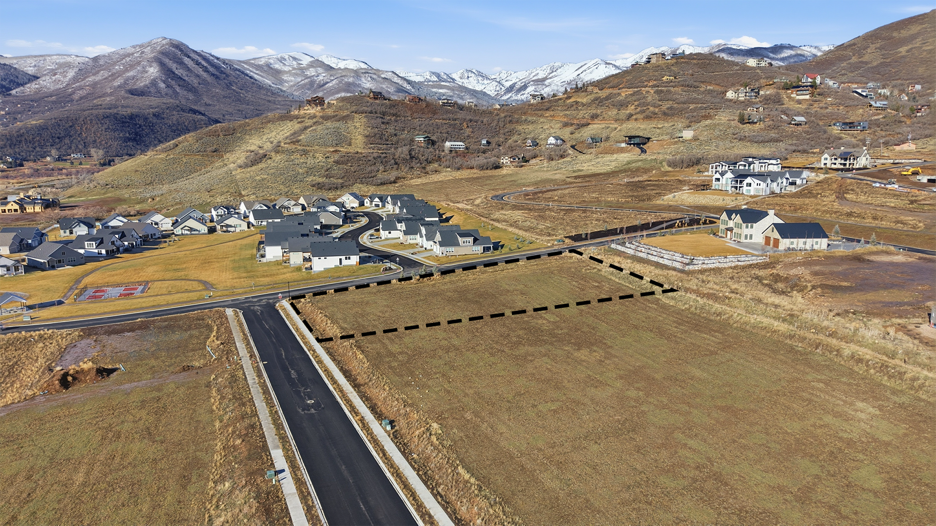 Aerial drone view of 1524 Canyon View Rd in Midway Utah with property boundary lines outlined in red, showing 1.04 acres of vacant land.