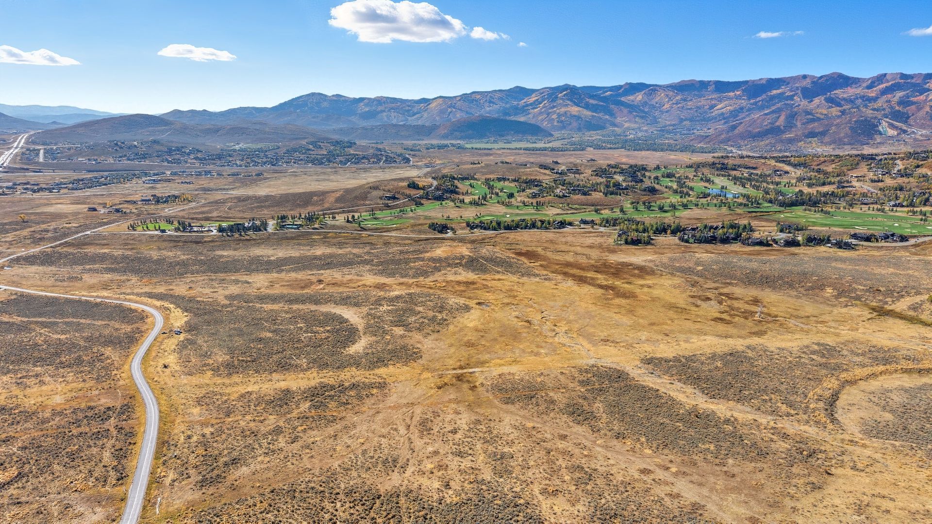 Ground-level landscape view of the 46-acre private equestrian estate site at 8151 Bitner Ranch Rd, highlighting natural scrub oak, open riding space, and direct trail access.