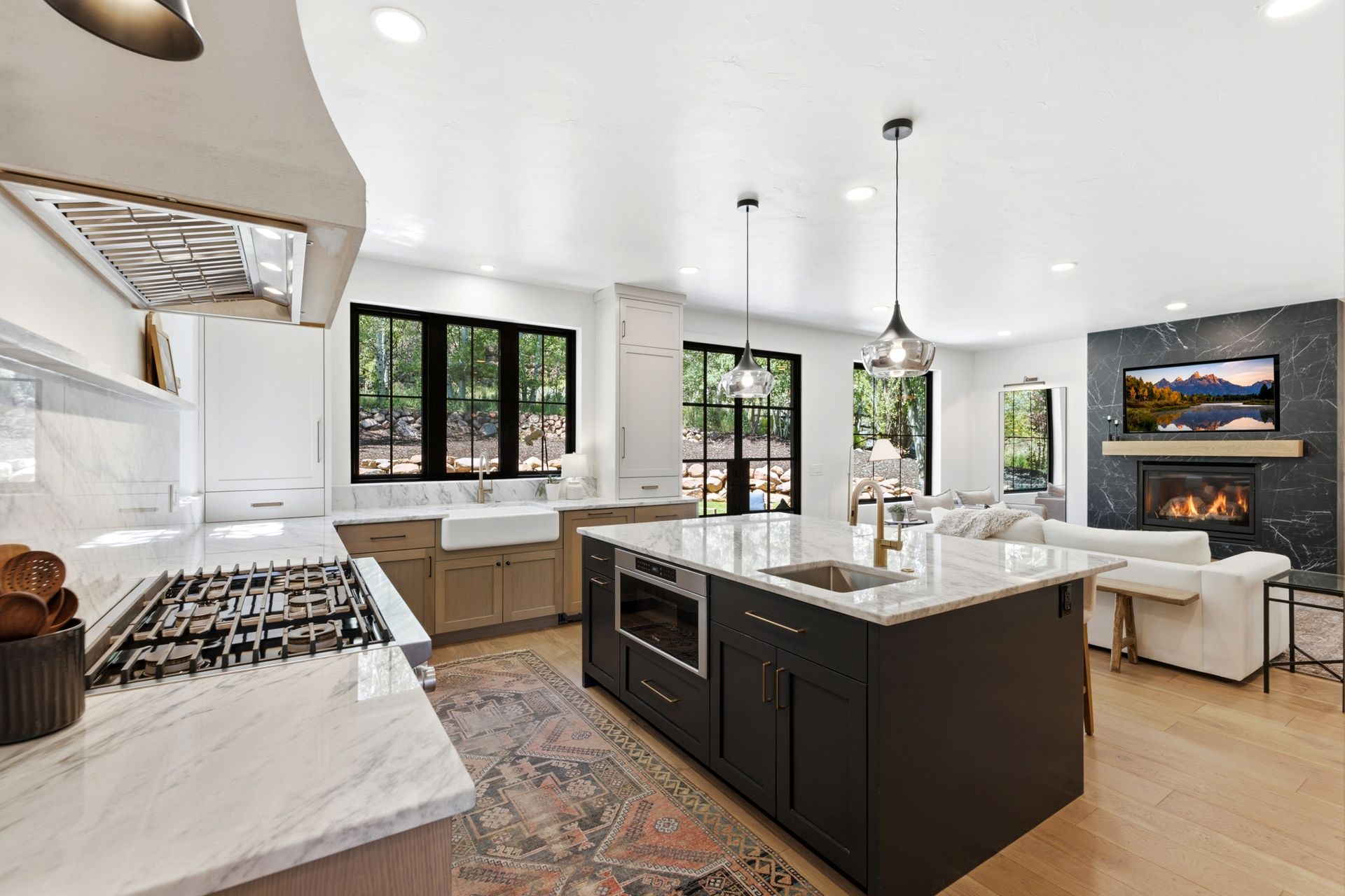 Luxury Chef's kitchen featuring a marble center island and premium Dacor appliances.