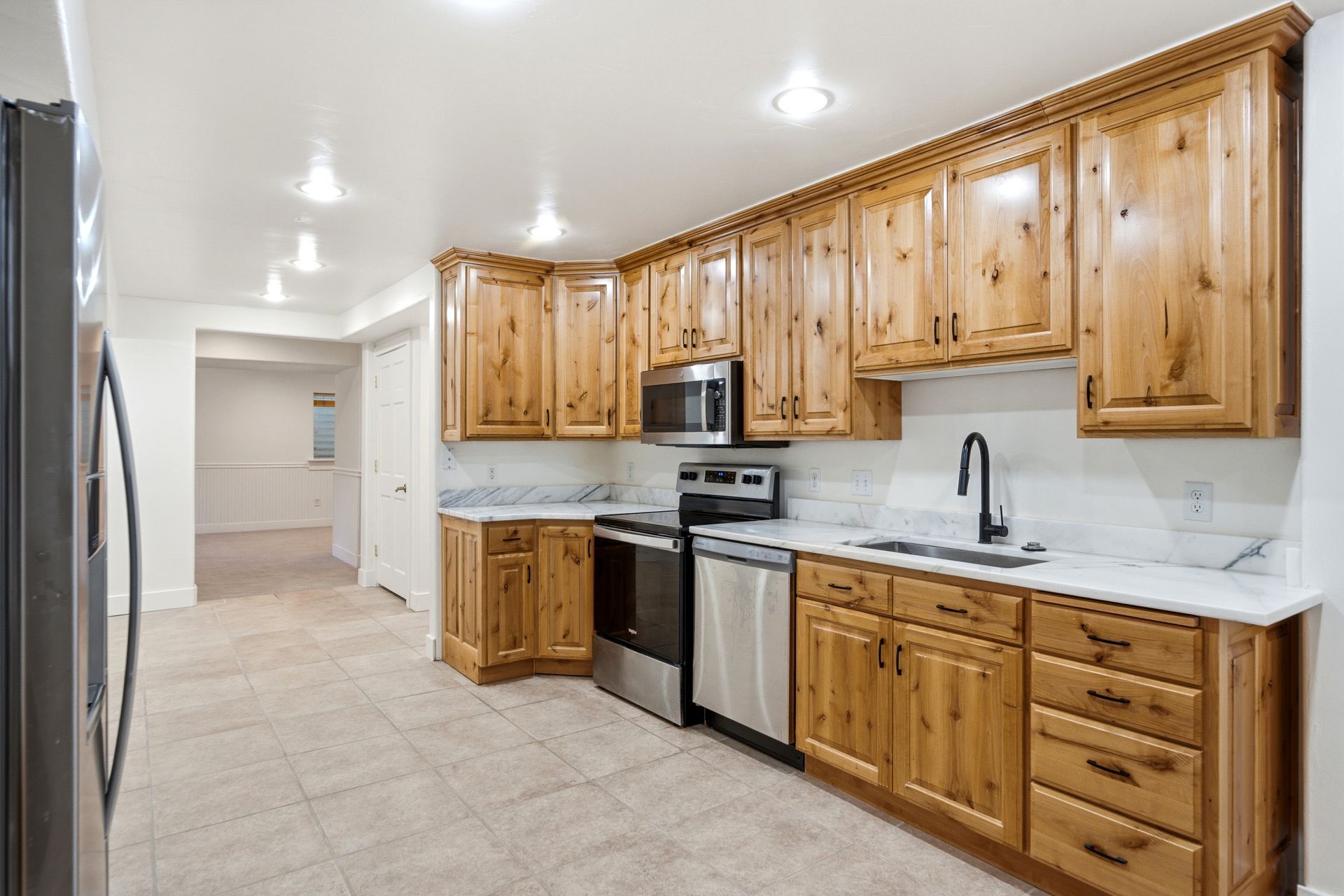 Fully equipped secondary kitchen in the independent lower-level guest apartment.