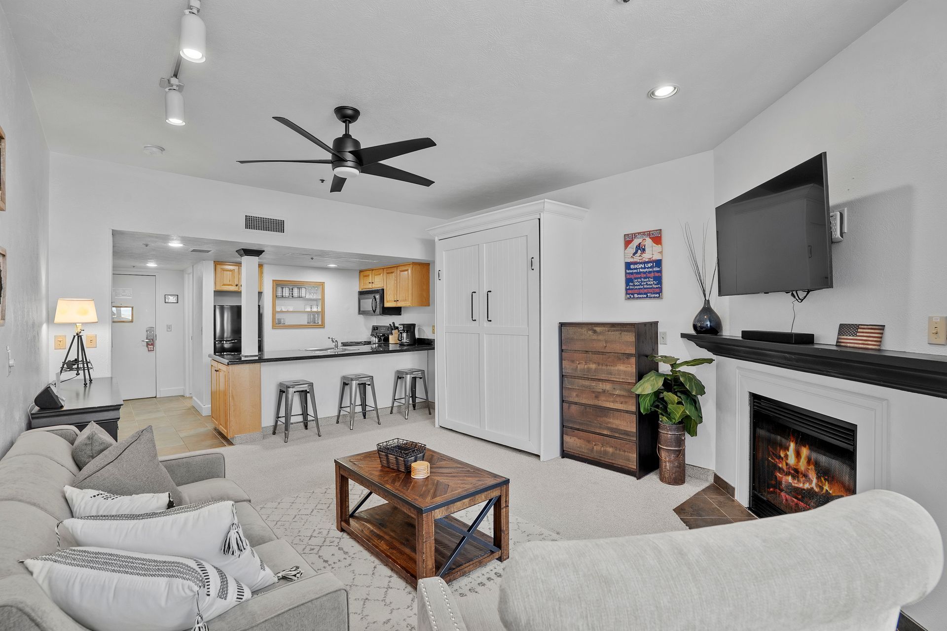 Main living area of ski-in/ski-out studio at Park City Mountain Resort featuring gas fireplace and granite kitchen counters.