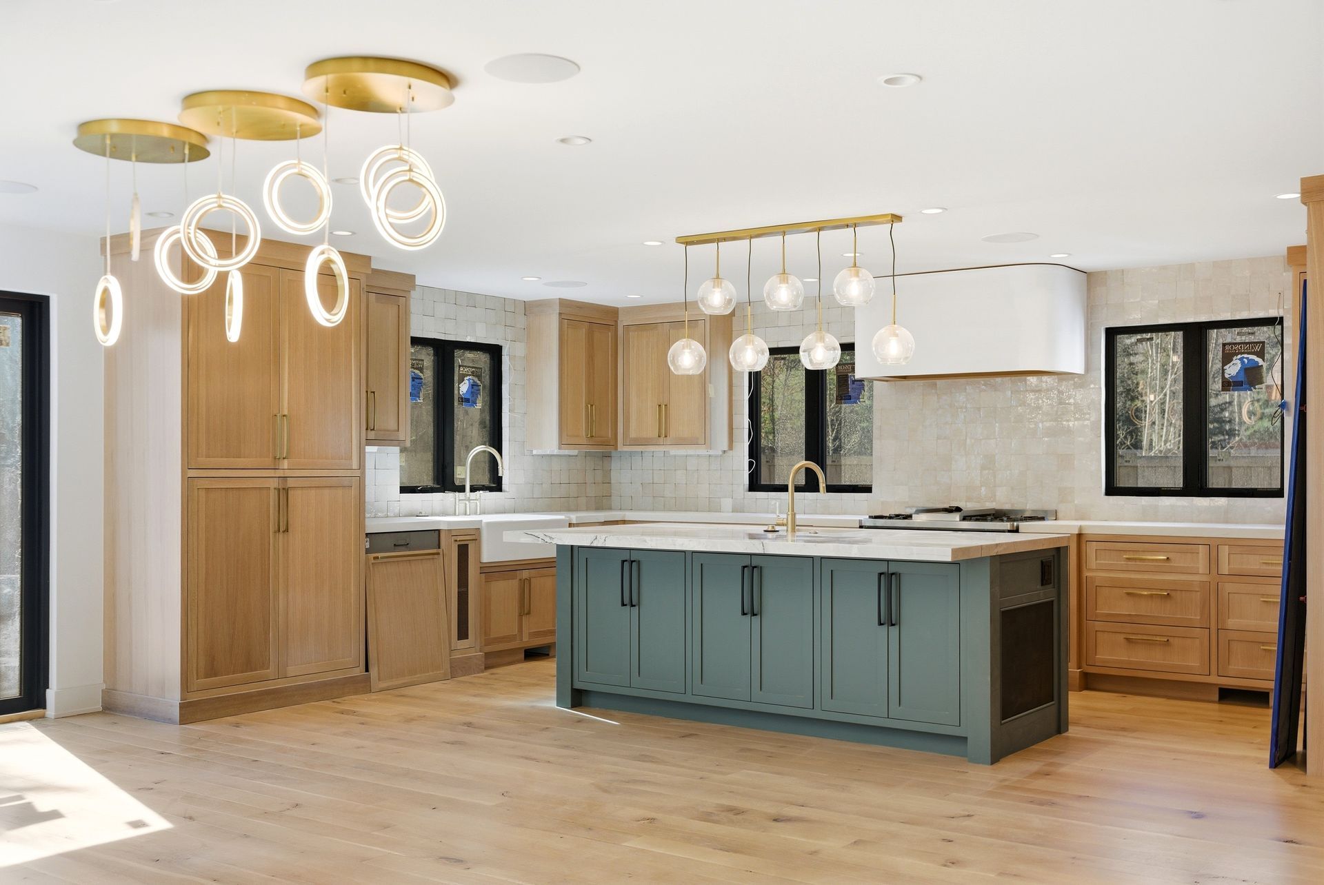 Wide view of the newly rebuilt chef's kitchen at 5272 Heather Lane, featuring an open concept design and ENERGY STAR appliances in Park City.