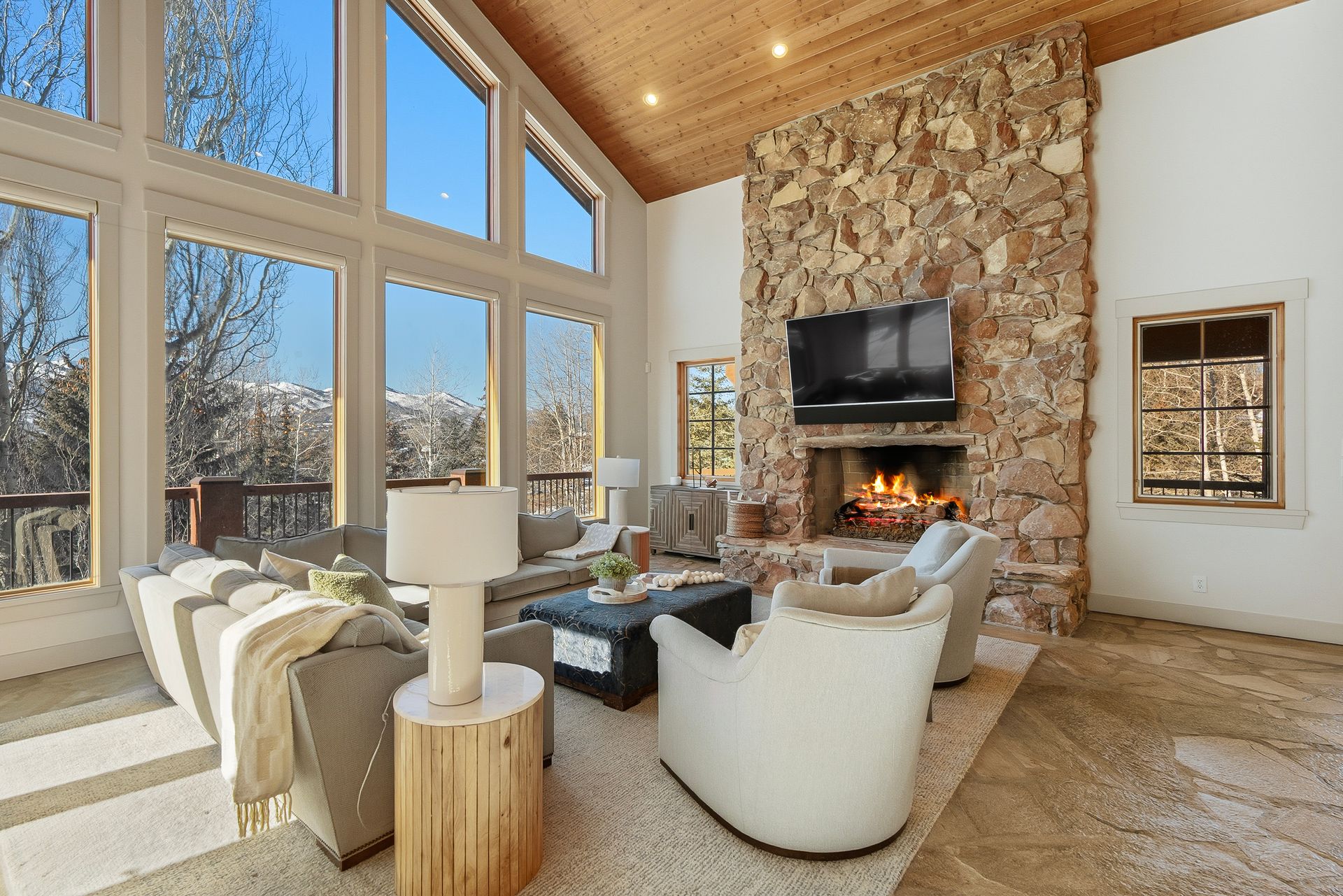 Floor-to-ceiling windows in the great room framing unobstructed views of the Wasatch Back mountains.