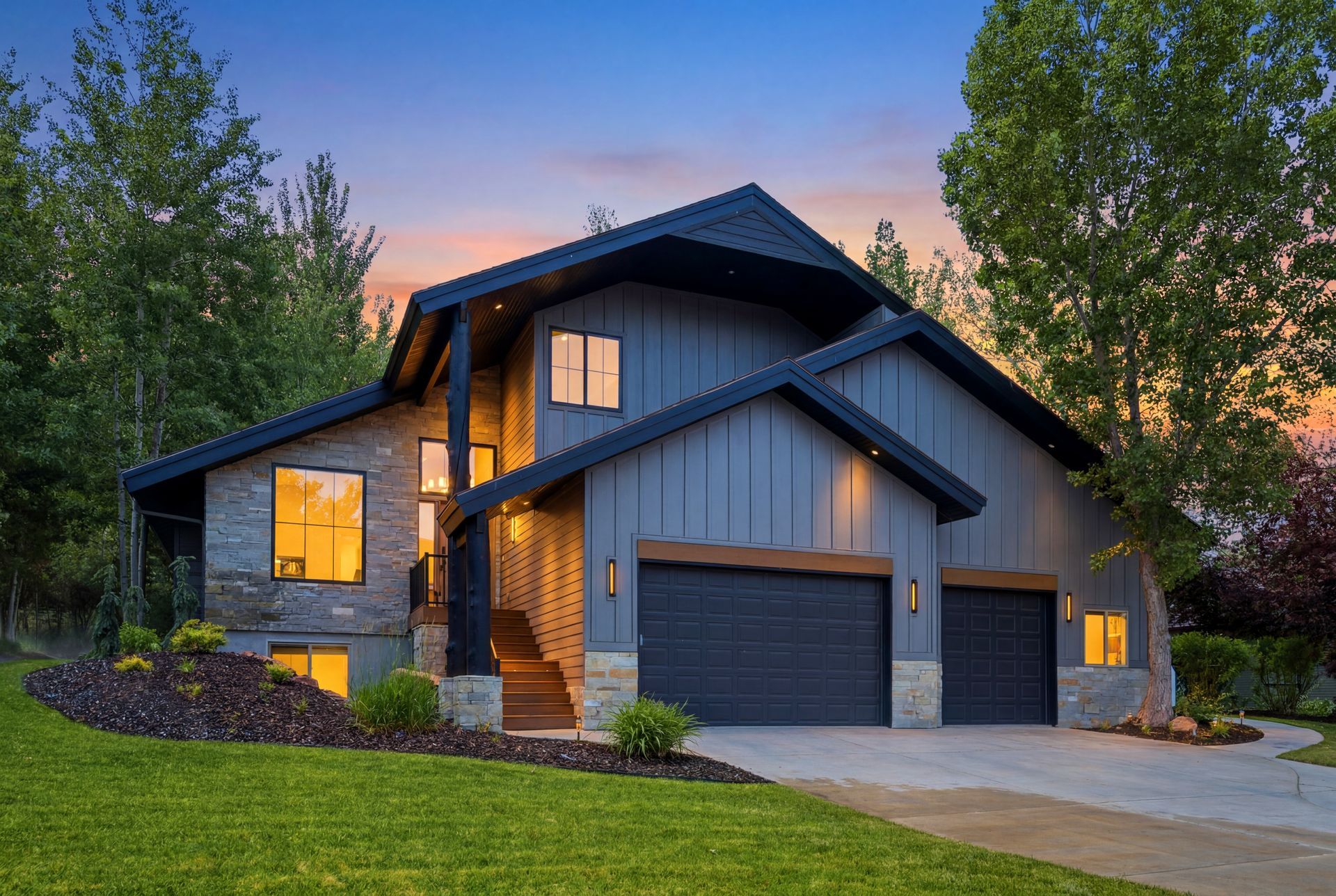 Twilight exterior of 3027 W Homestead Rd, a modern mountain luxury estate in Jeremy Ranch, Utah.