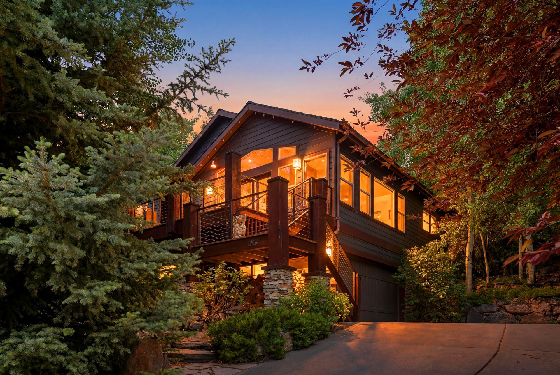 Stunning twilight exterior view of this extensively remodeled Deer Mountain luxury home in Kamas.