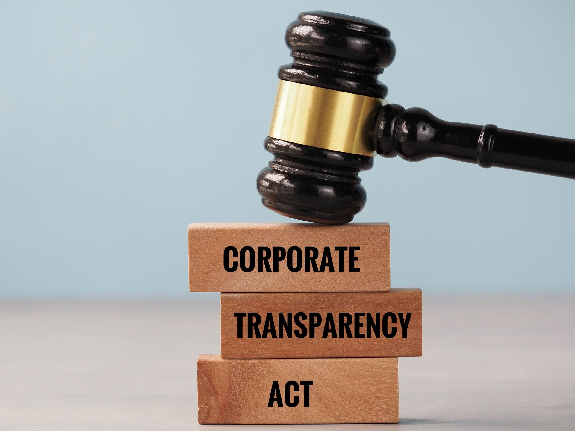 Hand adding coin to stack with graphic of house and rising percentage arrows.