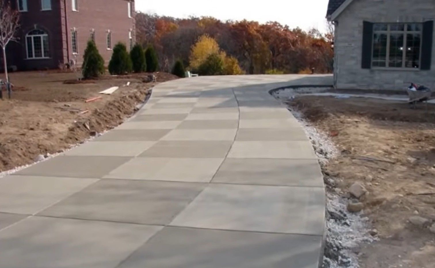 Checker-cut, broom-textured concrete driveway