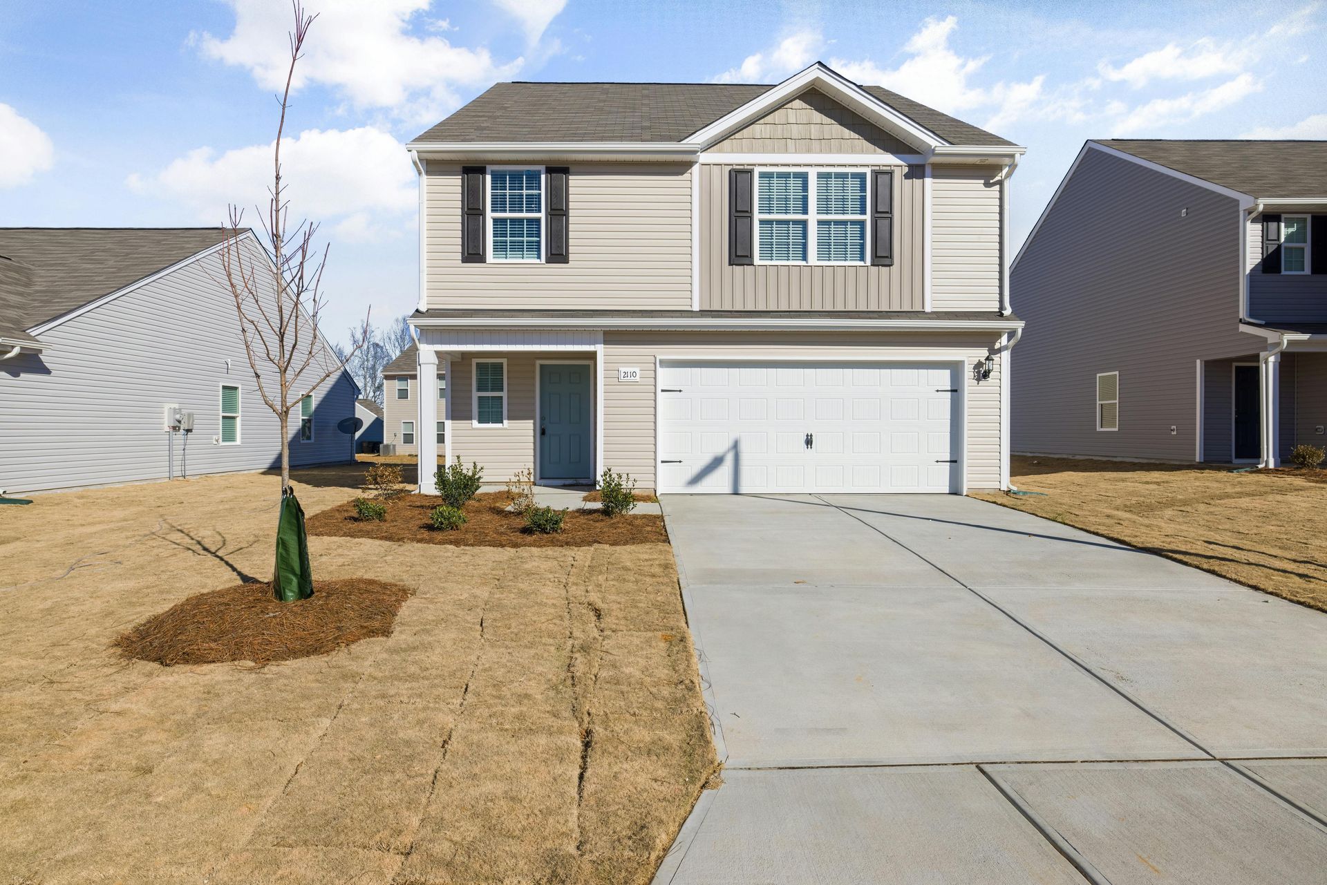 Concrete driveway completed for new house.