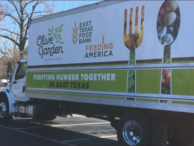 Olive Garden truck for East Texas Food Bank, white with logo, fork and spoon, 