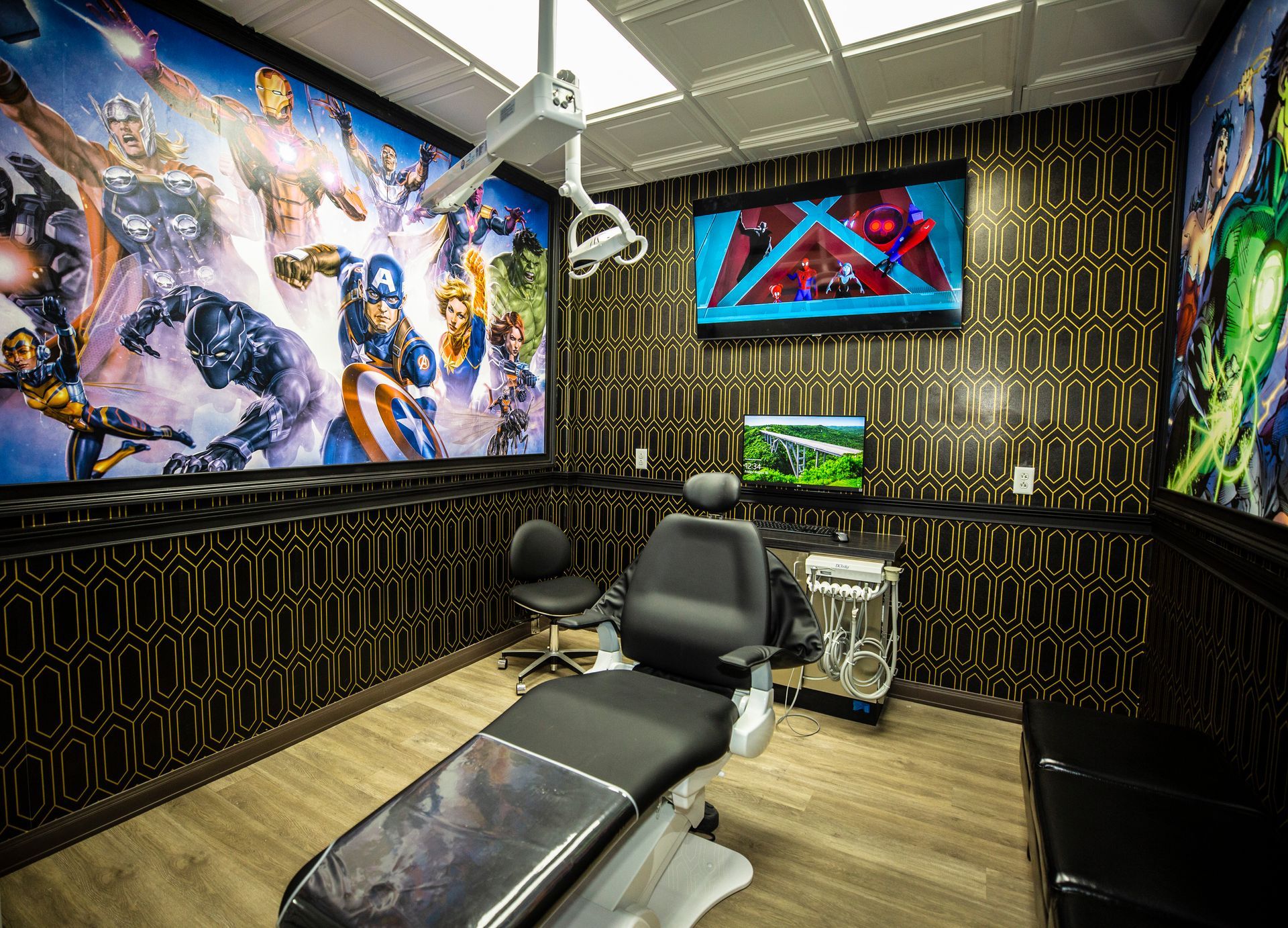 Super Dentists  in San Antonio  A dental office with a superhero mural on the wall and a dental chair.
