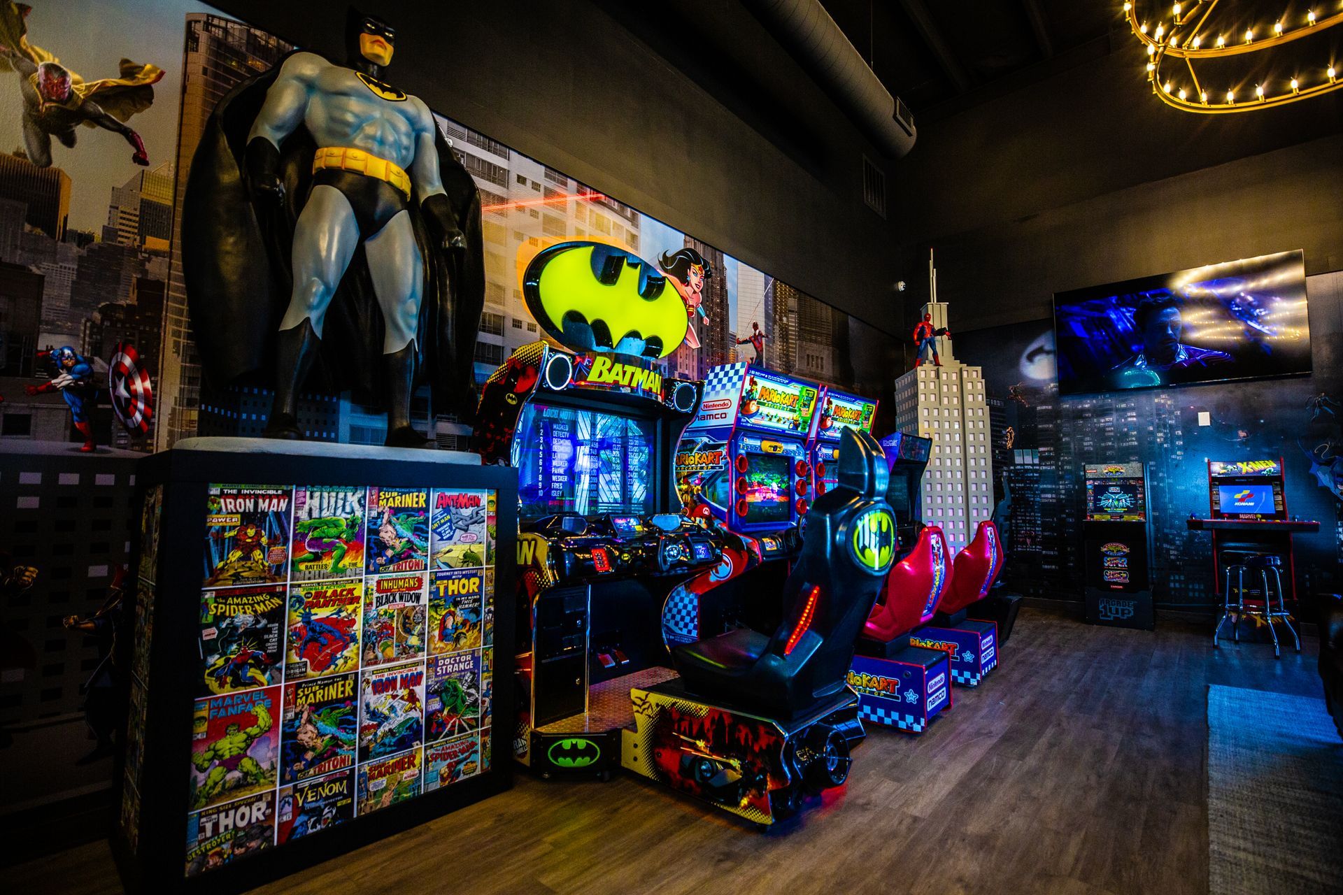 Super Dentists  in San Antonio  A room filled with lots of arcade games and a statue of batman.