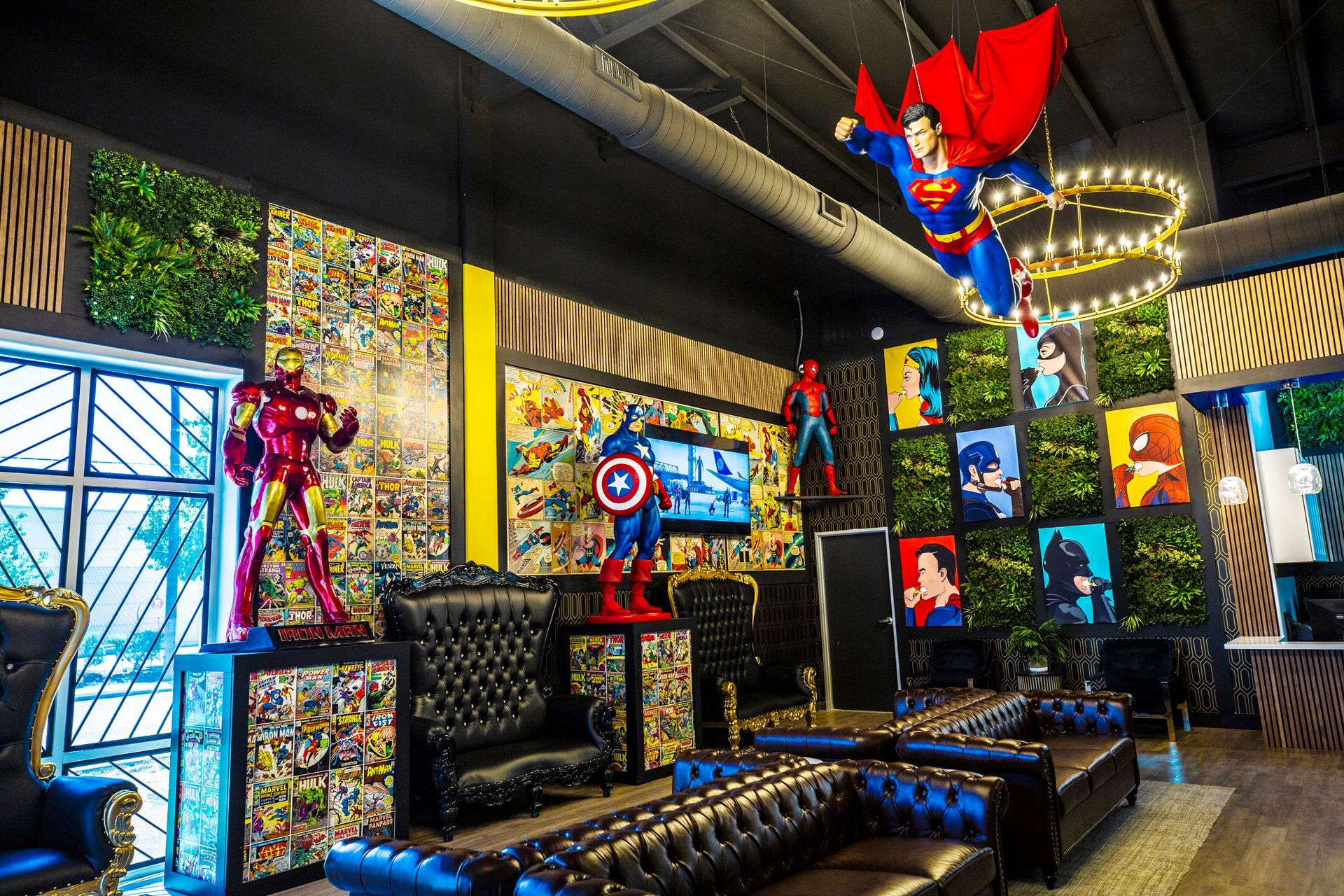Super Dentists  in San Antonio  A living room with a lot of superhero statues hanging from the ceiling.