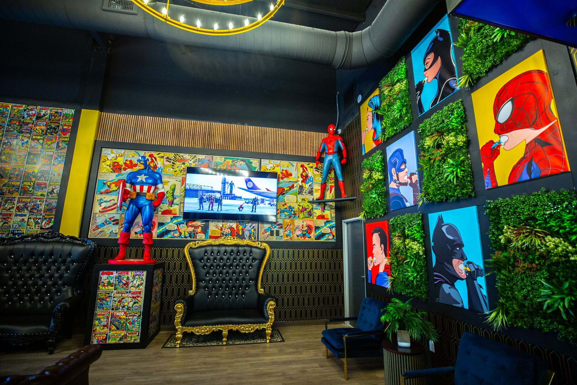 Super Dentists  in San Antonio  A room with a couch , chairs , and a statue of a superhero on the wall.