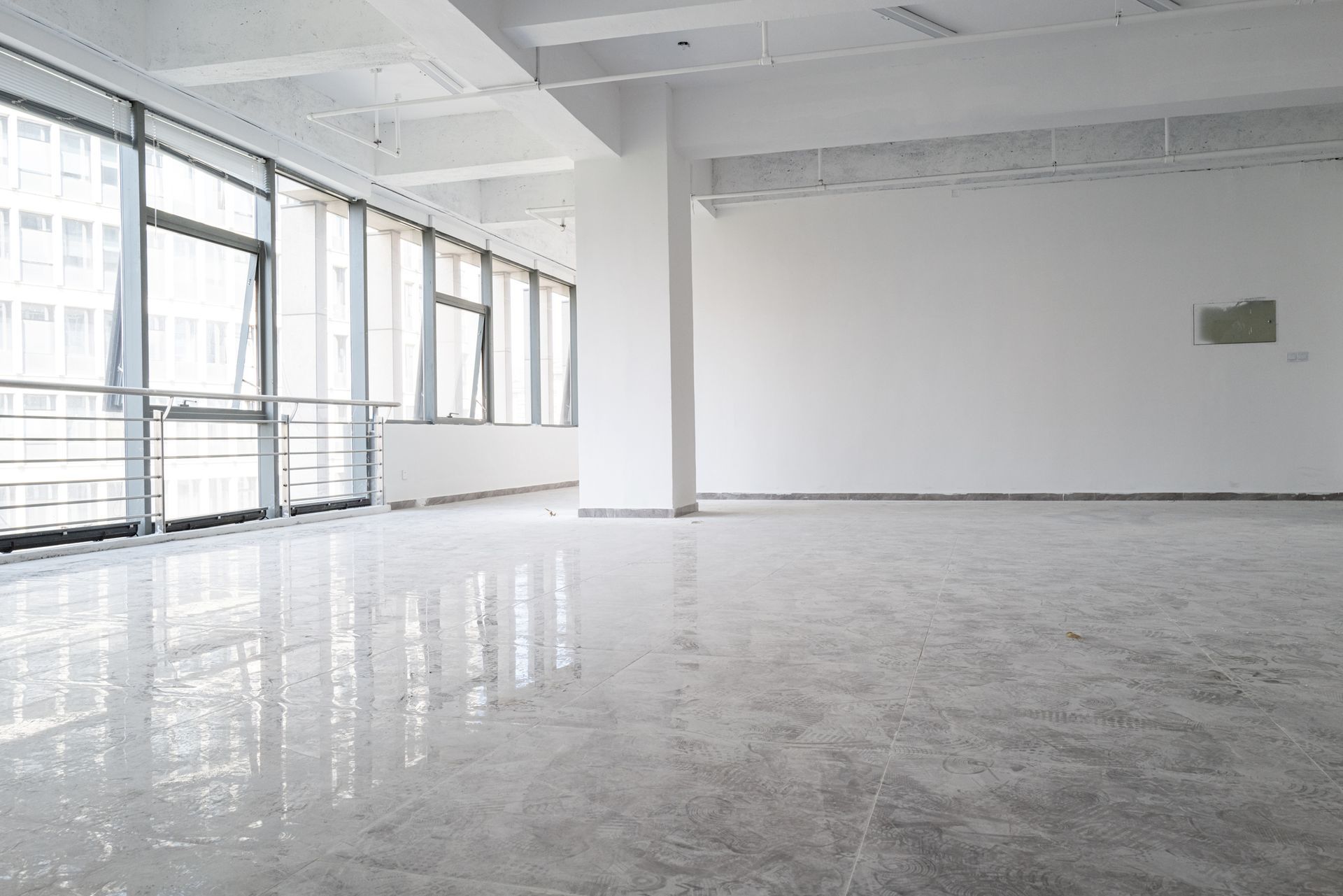 Bright, open space featuring a gleaming concrete floor coating