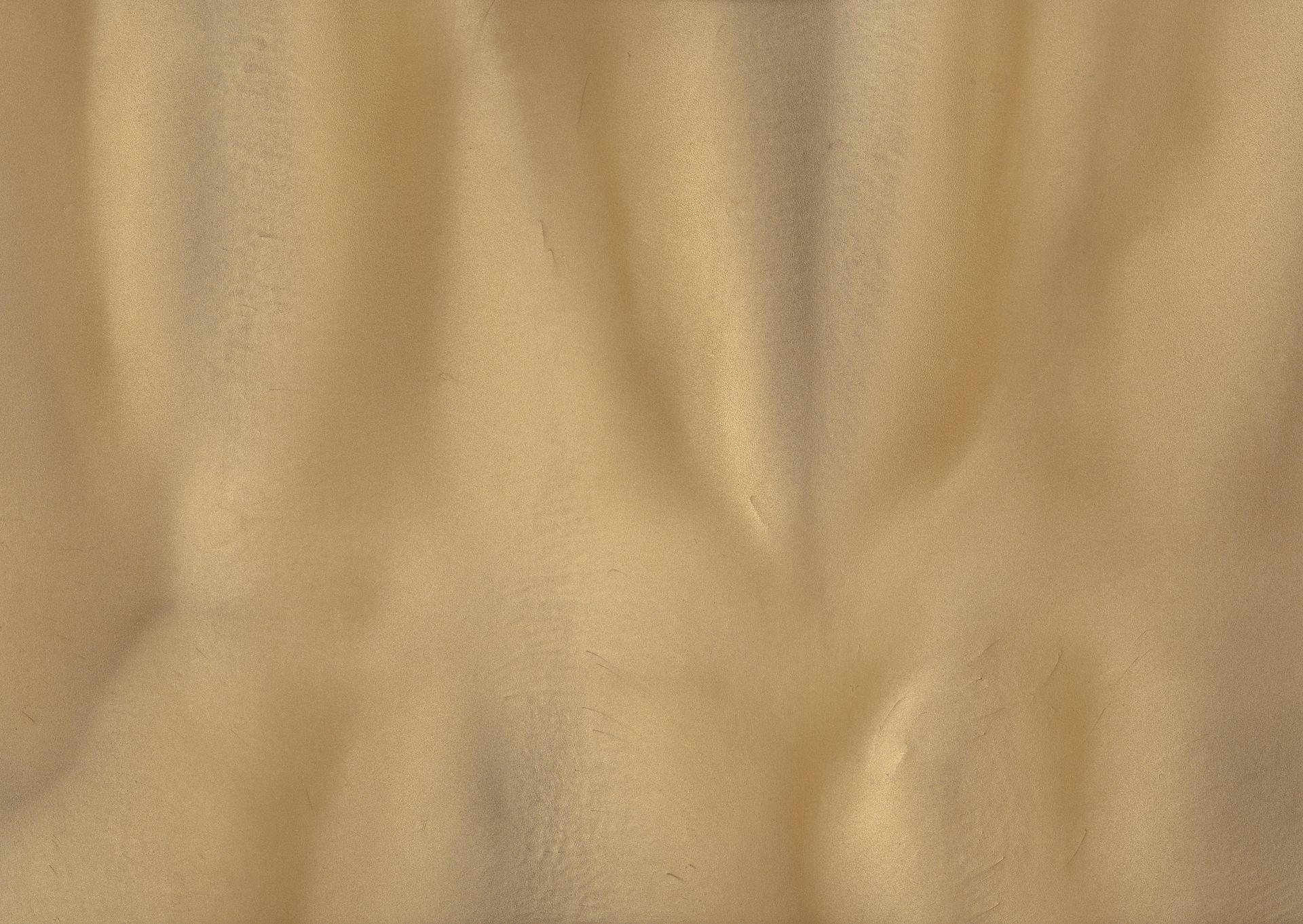 Yellow fabric with soft folds and shadows.