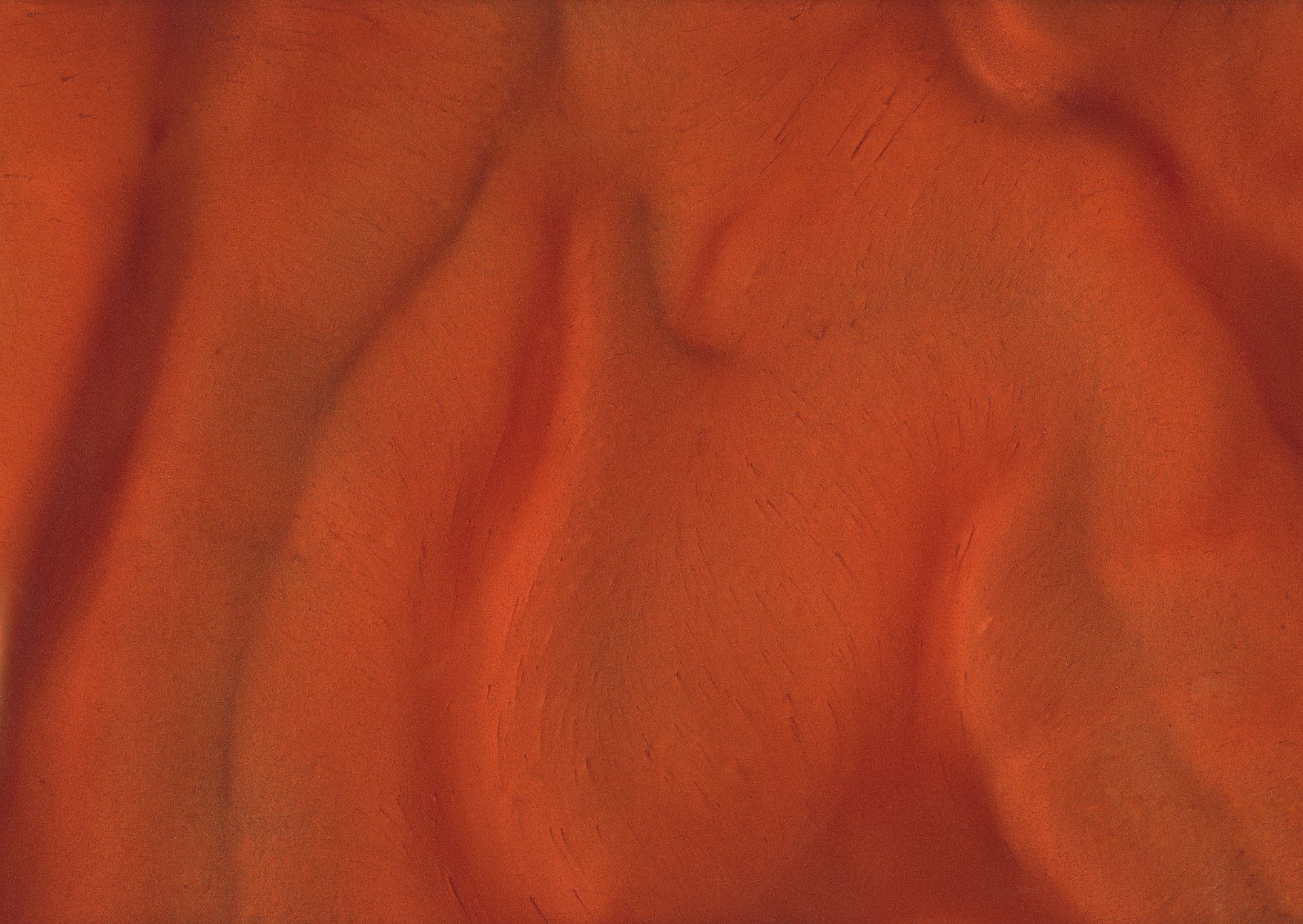 Orange fabric with soft folds and a subtle texture.