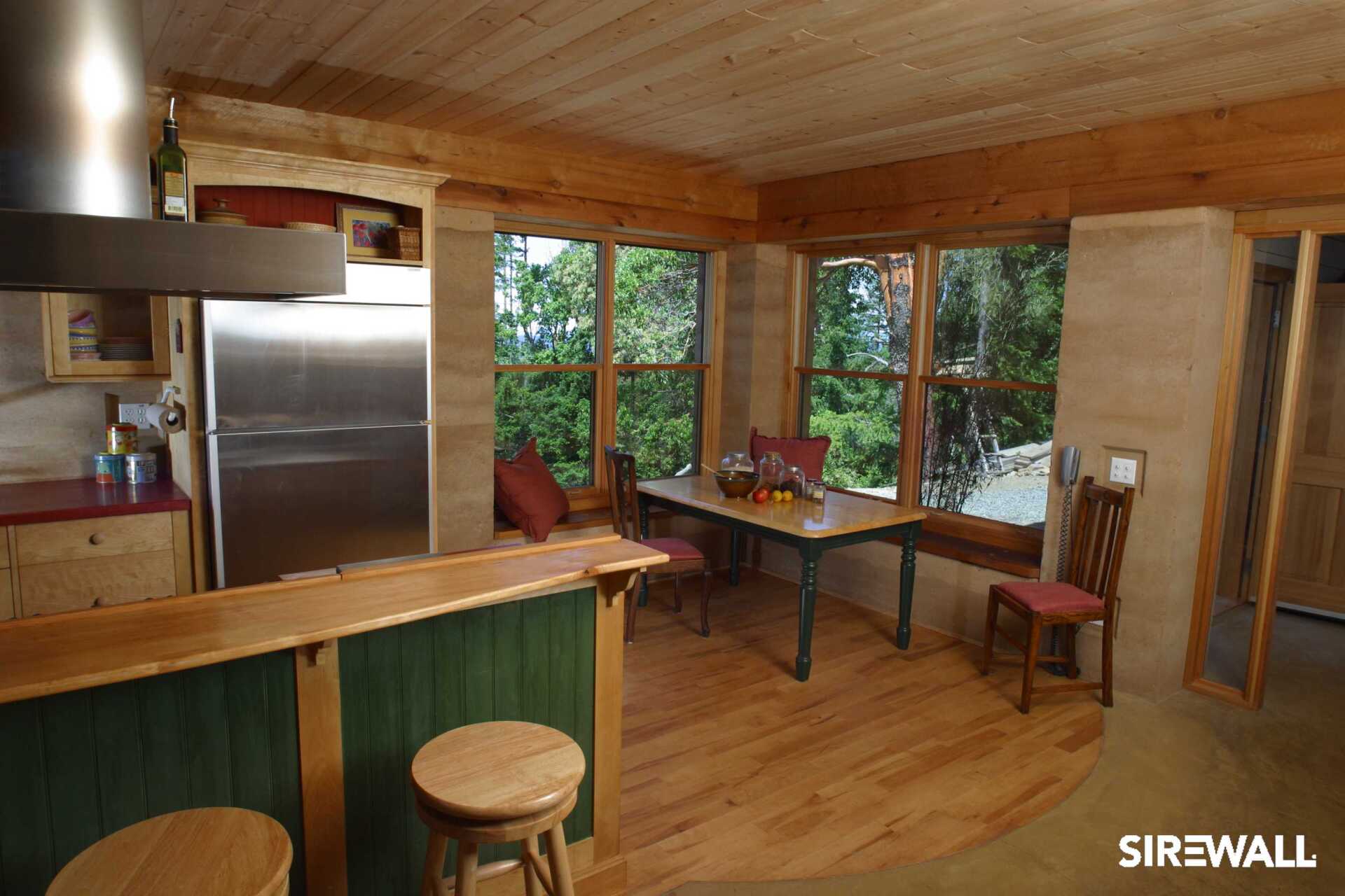 Interior of a SIREWALL home's kitchen with natural finishes.