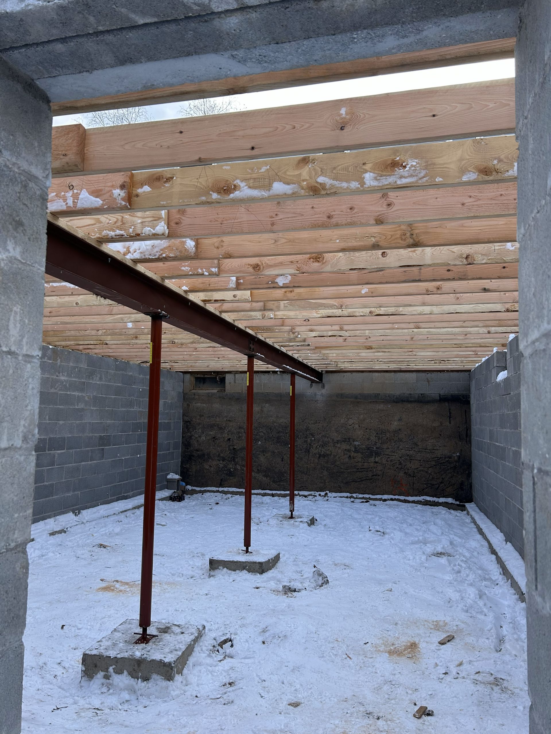 A hallway with a blue cabinet and shelves