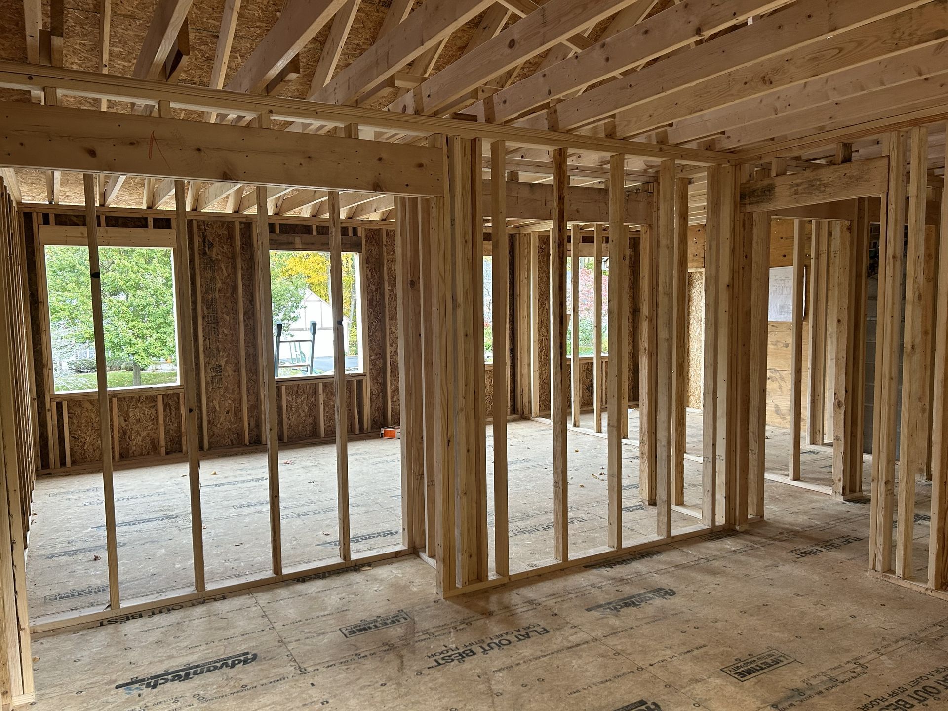 A white staircase with black railings in a house