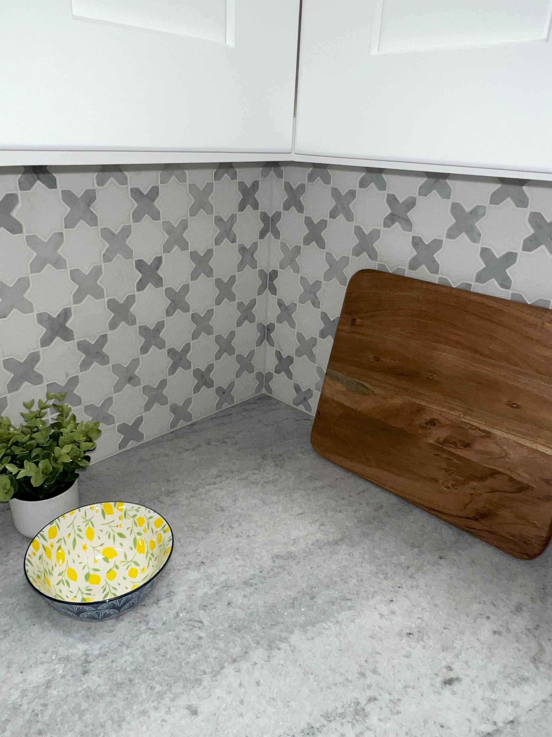 A living room with a couch , coffee table , and rug.